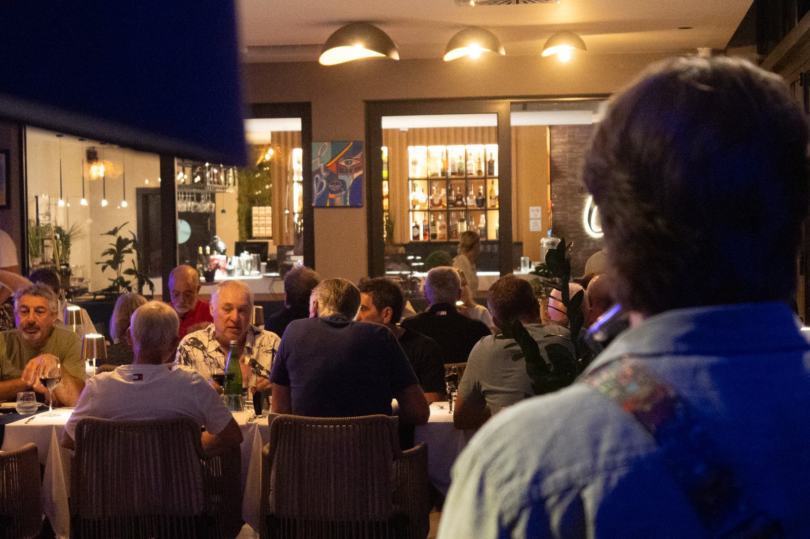 Guests sharing an evening meal inside Cielo
